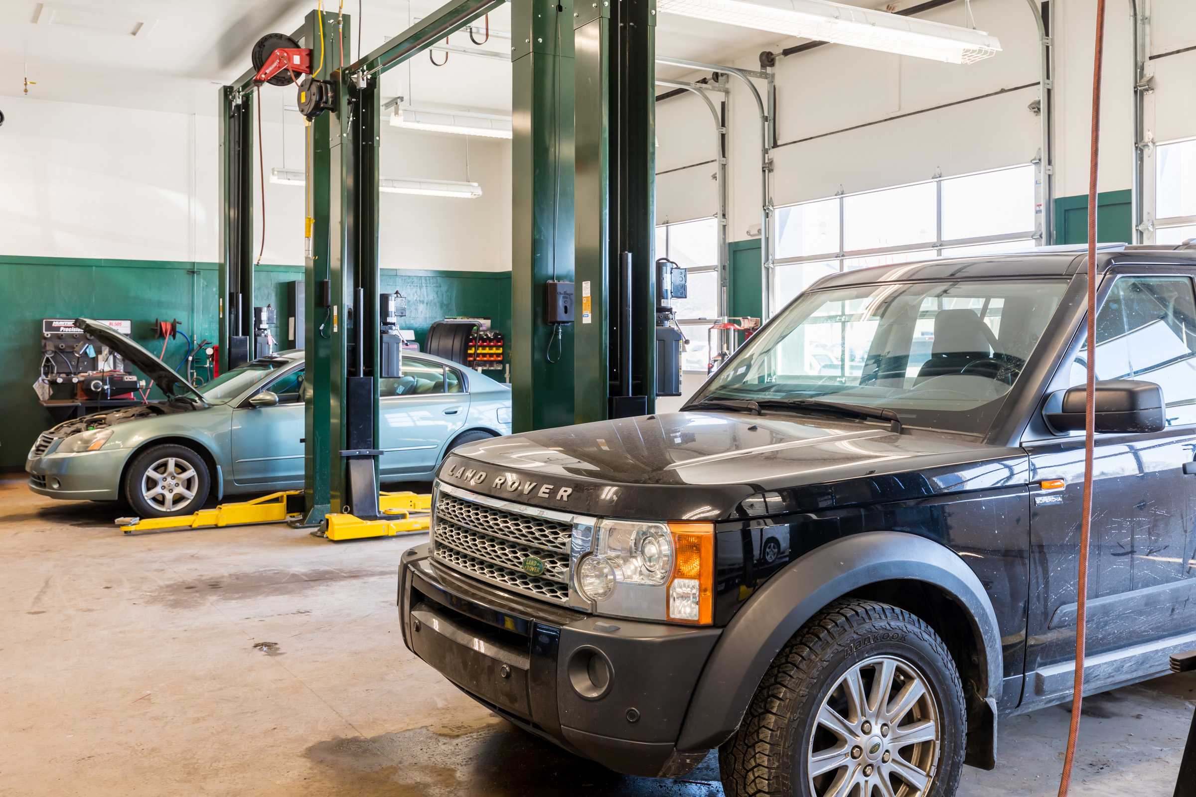 Vehicles in the CBAC garage bays undergoing maintenance